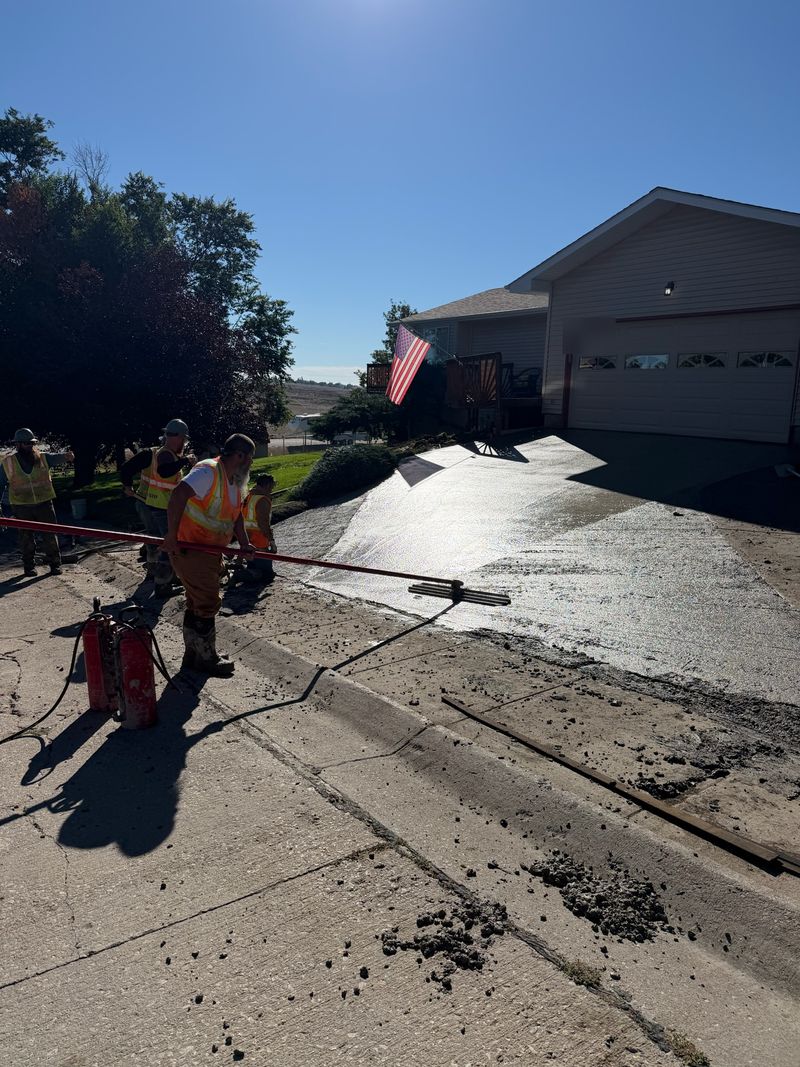 Concrete being poured over a heated driveway system