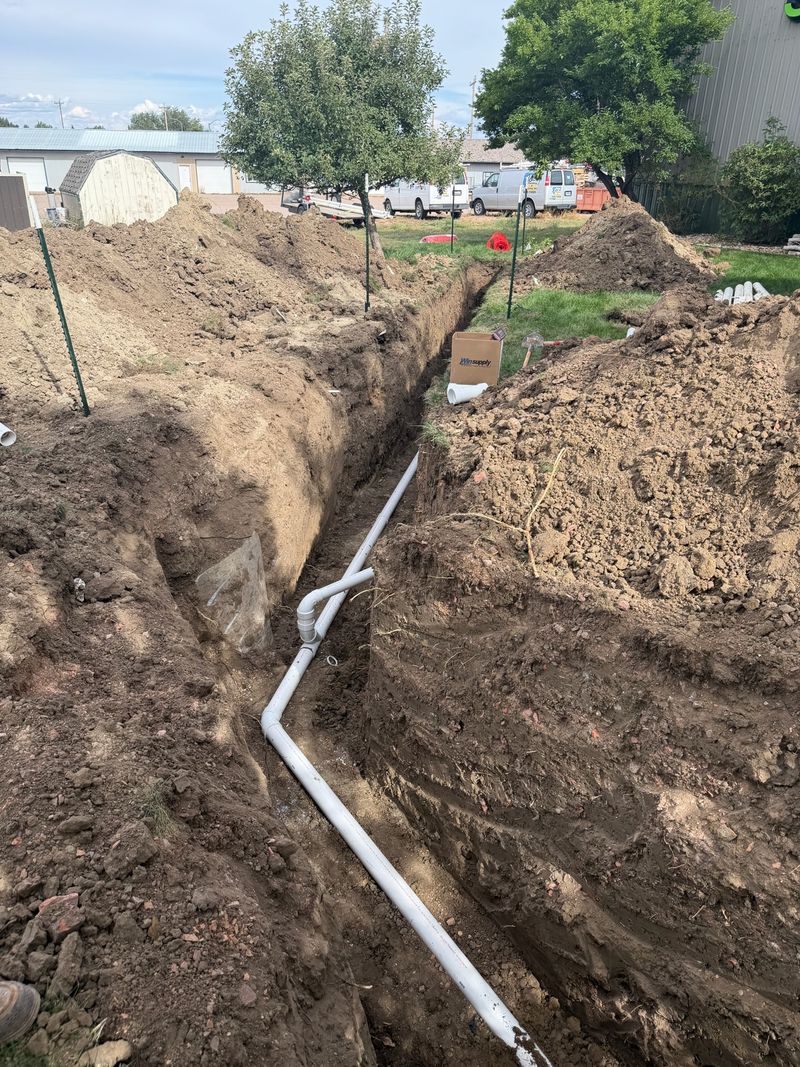 New PVC sewer line laid in an open trench