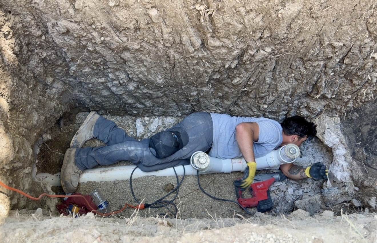 Paragon Plumbing technician repairing an underground line